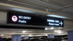 Digital parking signs with showed word no entry and exit and available space.