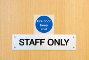 staff only door sign outside workplace